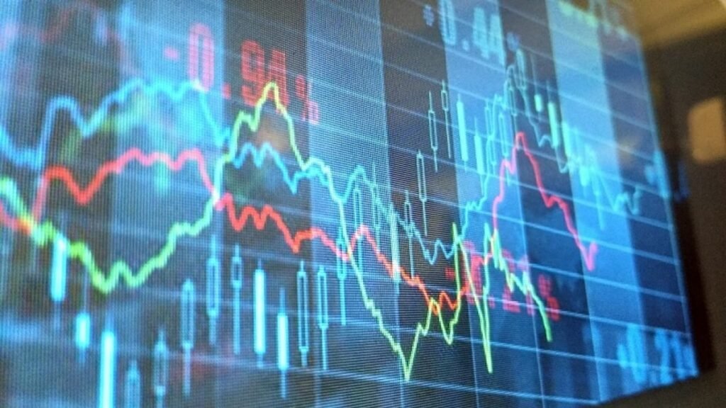 graph lines against the stock market board