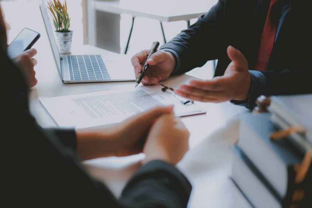 business agent explaining contract to couple, representing Charitable Remainder Trust